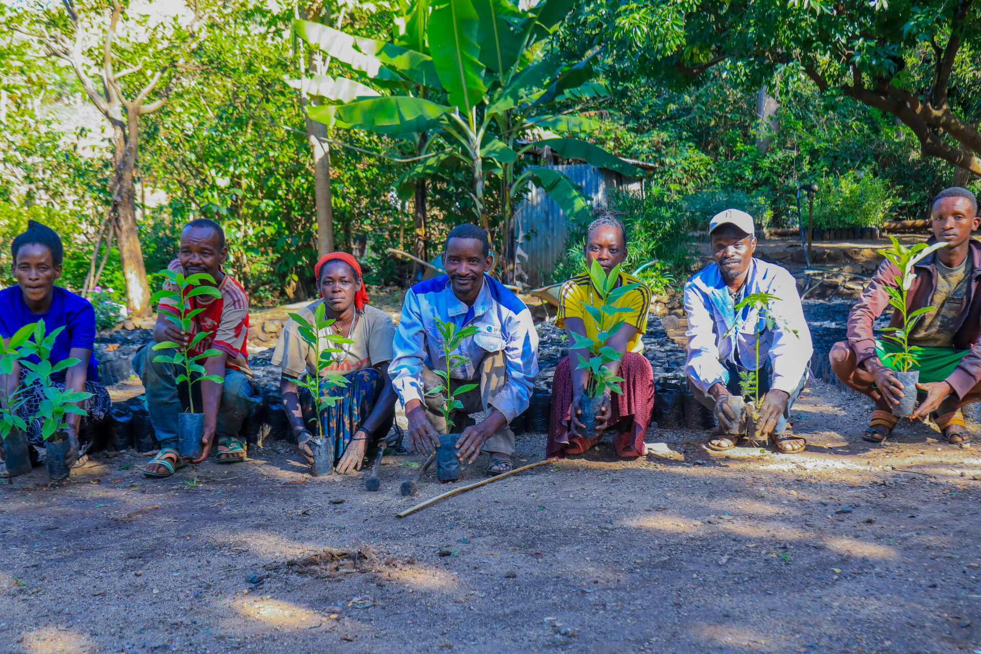 Gizachewu Gilana, centre, with his team at the Gocha Kebele tree nursery