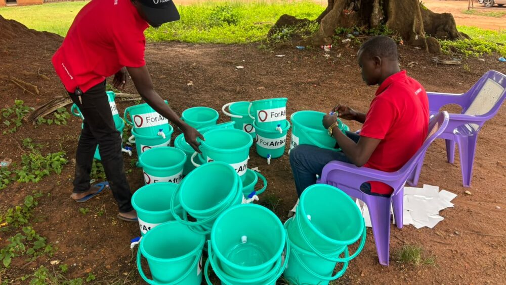 ForAfrika team preparing the handwashing stations at Mongoumba, Central African Republic. ForAfrika: Yonic Gaombalet ForAfrika-team-preparing-the-handwashing-stations-at-Mongoumba-Central-African-Republic.-ForAfrika-Yonic-Gaombalet