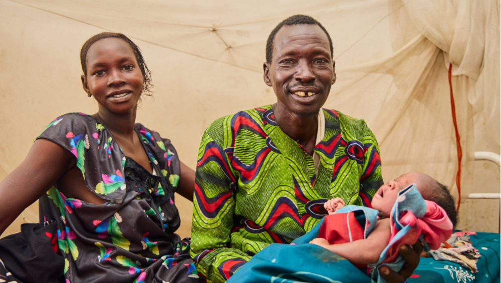Agachok Leyik and her husband Kayok Gai and their newborn baby after a safe delivery managed by ForAfrika medical personnel in Greater Pibor, South Sudan Agachok Leyik and her husband Kayok Gai and their newborn baby after a safe delivery managed by ForAfrika medical personnel in Greater Pibor, South Sudan.