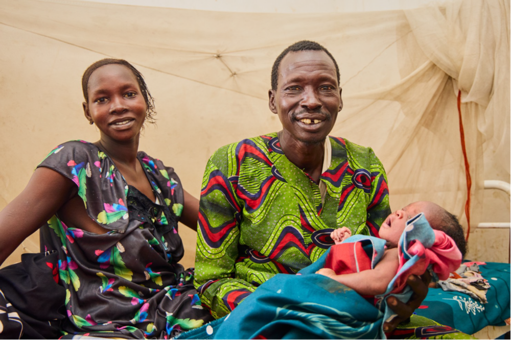 Agachok Leyik and her husband Kayok Gai and their newborn baby after a safe delivery managed by ForAfrika medical personnel in Greater Pibor, South Sudan.