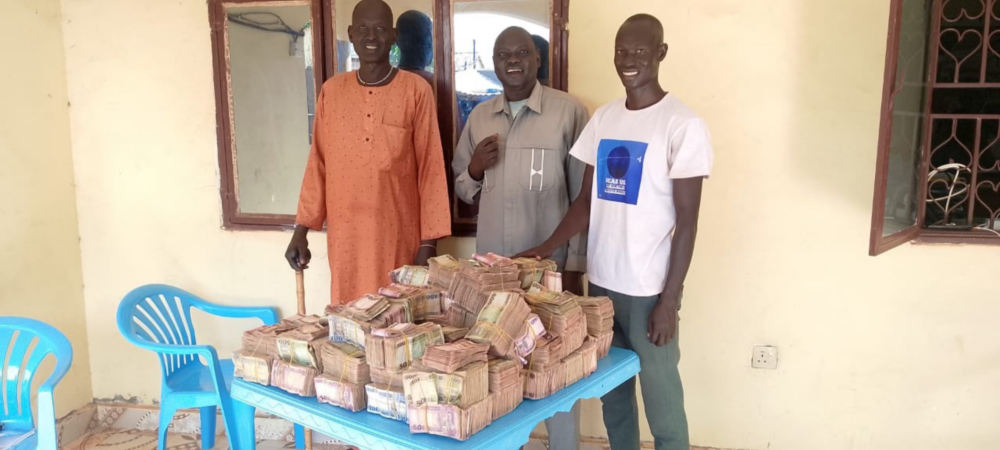 Group leaders of Lithok Rice Farm with proceeds from the community’s first rice harvest during the official seed handover in Mathiang Boma